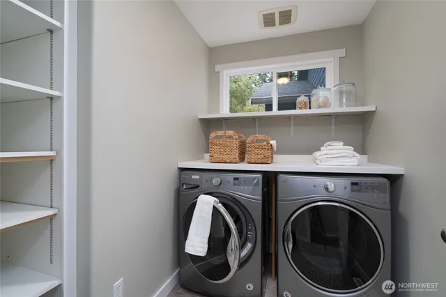 a utility room with dryer and washer