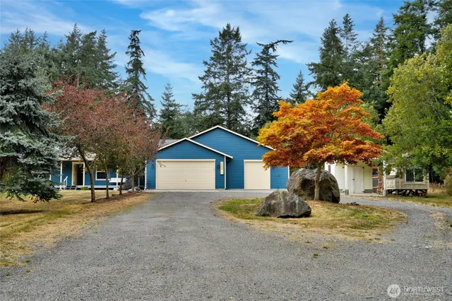 a view of a road with a house in the background