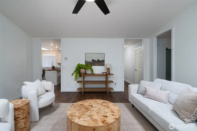 a living room with furniture and a rug