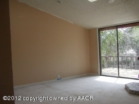914 South Rusk Street Amarillo, TX 79102 - Photo 6 of 11 a view of an empty room with a window