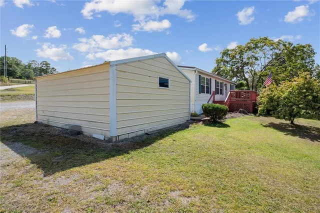 a view of a field with an trees