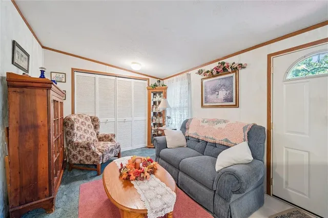 a bedroom with a bed and a television