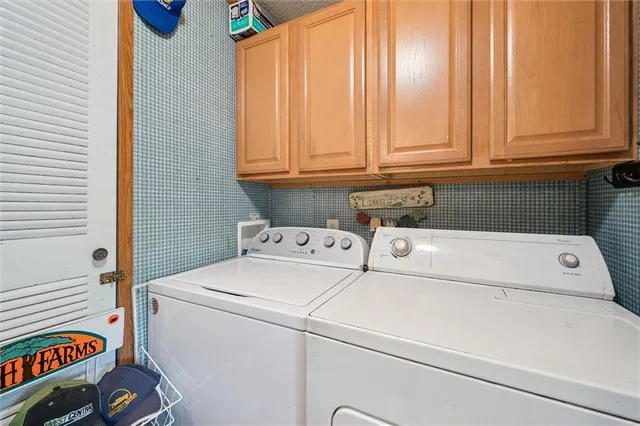 a bedroom with furniture and a large window