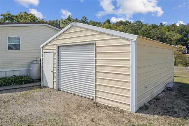 an aerial view of a house with yard