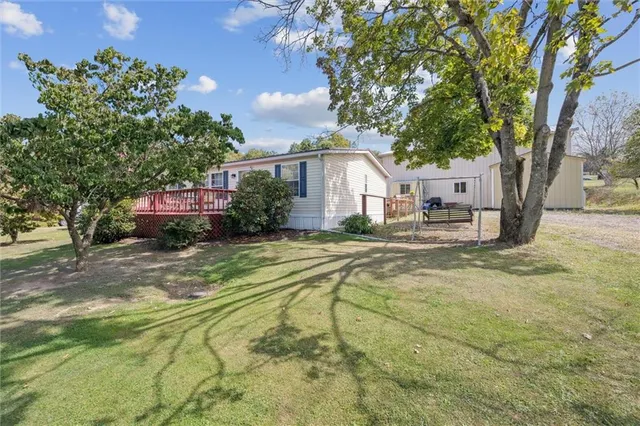 a view of a house with basketball court