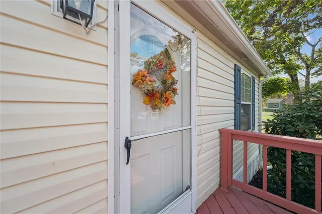 a view of a chairs and table in the balcony