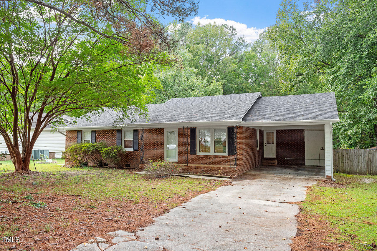 5808 Meadowbrook Road Raleigh, NC 27603 - Photo 1 of 18 front view of a house with a yard