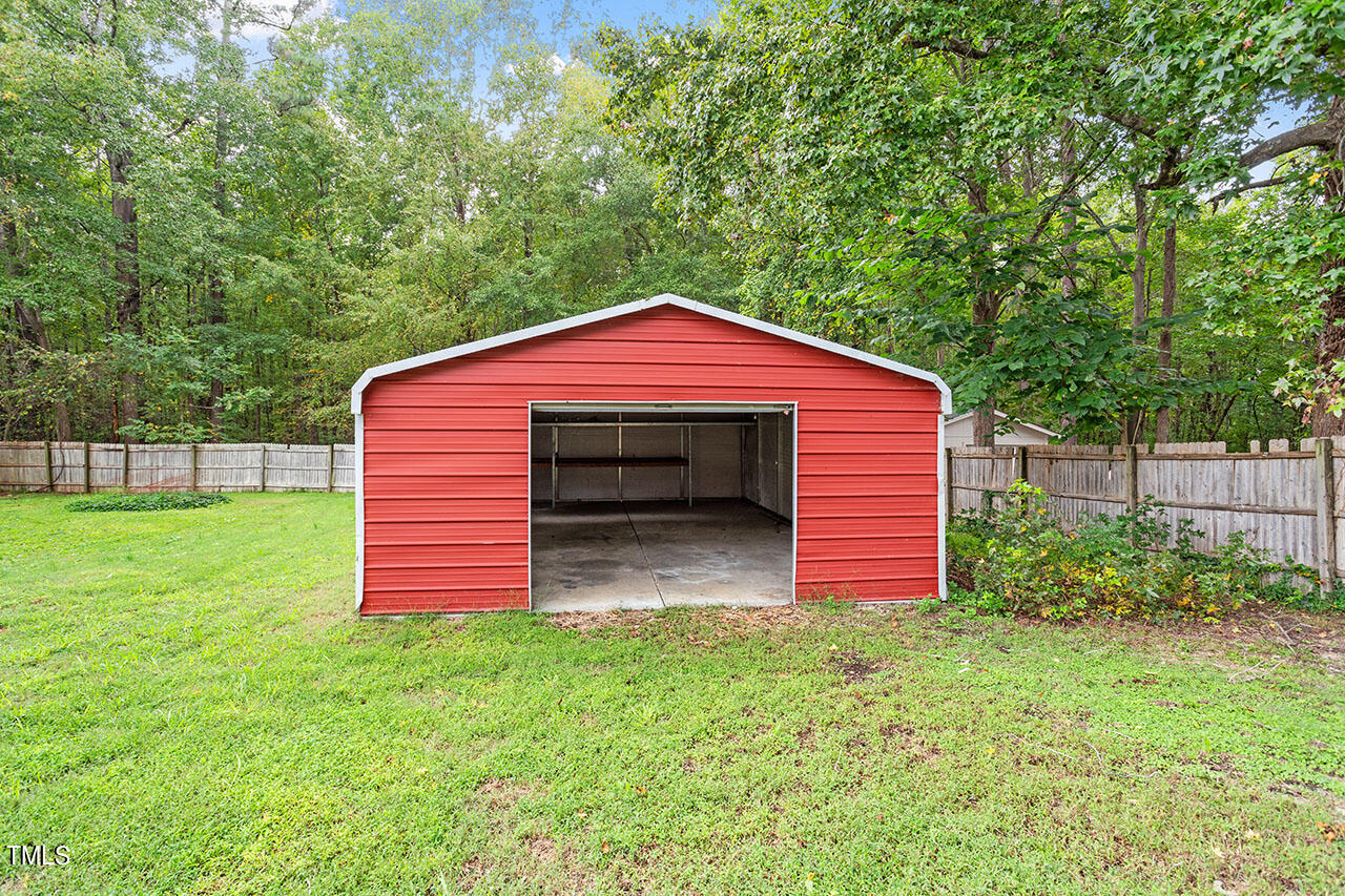 5808 Meadowbrook Road Raleigh, NC 27603 - Photo 5 of 18 a front view of a house with a yard