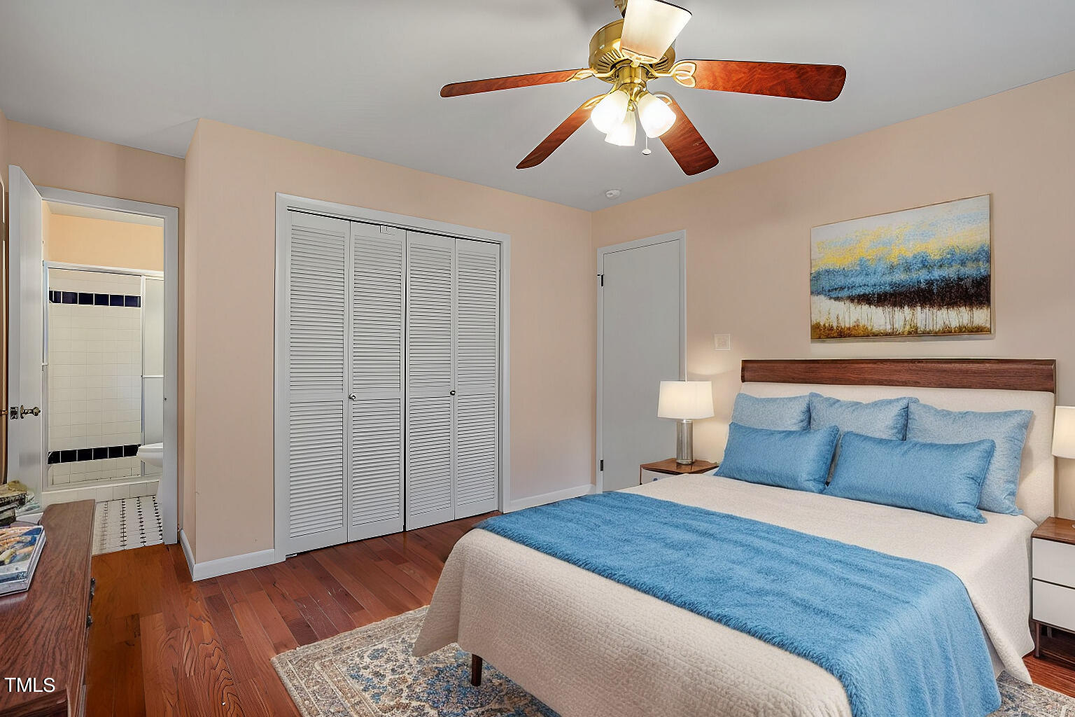 5808 Meadowbrook Road Raleigh, NC 27603 - Photo 10 of 18 a bedroom with a bed and a chandelier