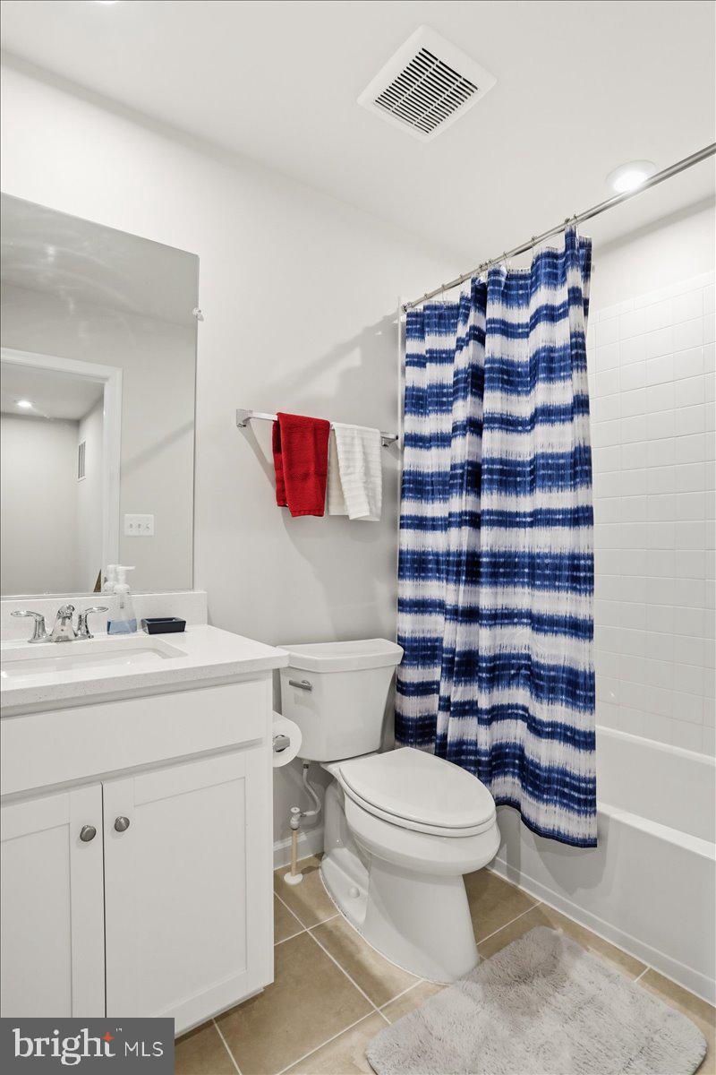 186 Coolidge Avenue Ranson, WV 25438 - Photo 26 of 41 Modern bathroom with vibrant accents.
