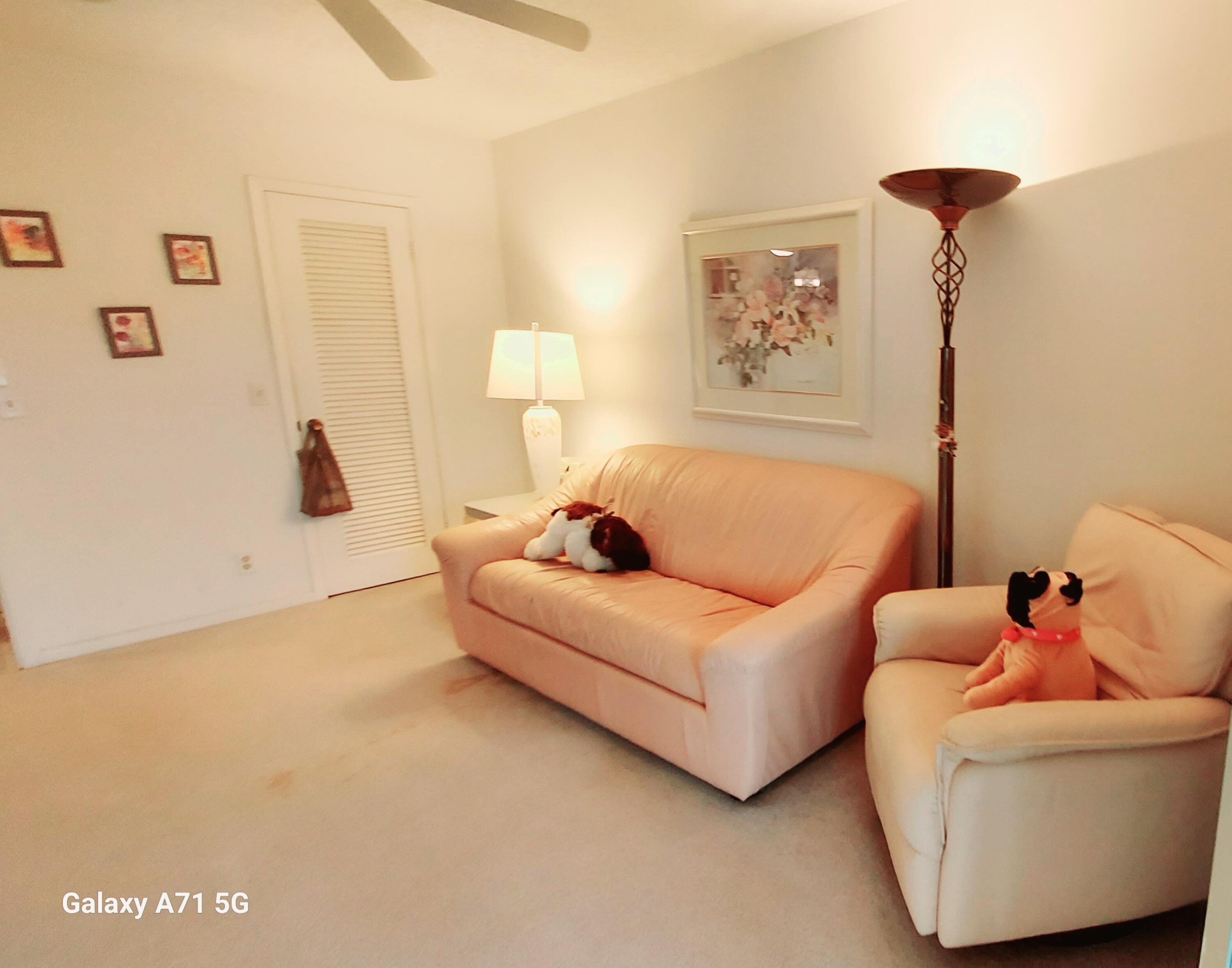 4079 Cornwall East, Unit 4079 Boca Raton, FL 33434 - Photo 13 of 41 a living room with furniture and a window