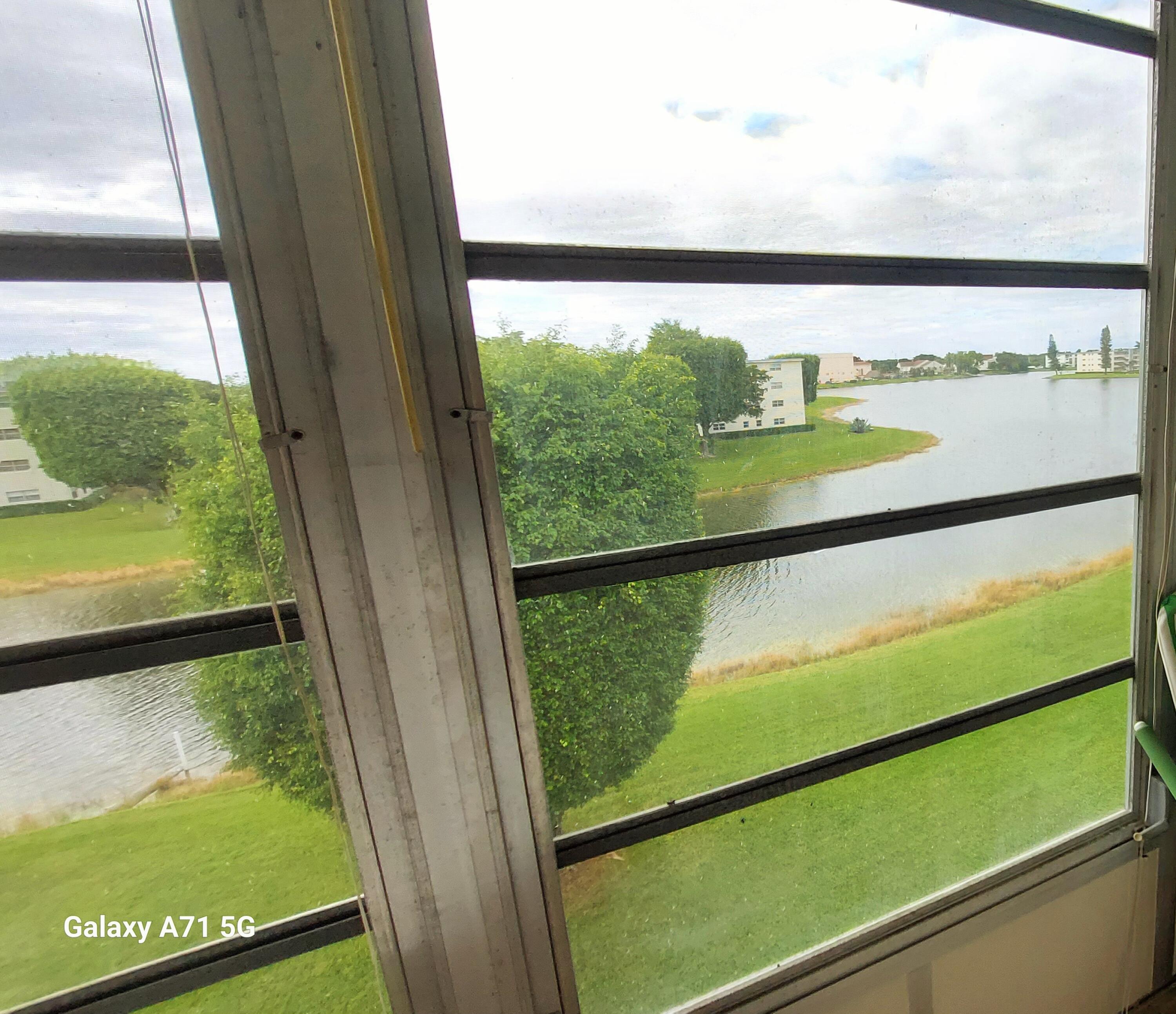 4079 Cornwall East, Unit 4079 Boca Raton, FL 33434 - Photo 18 of 41 a view of a glass door with a lake view