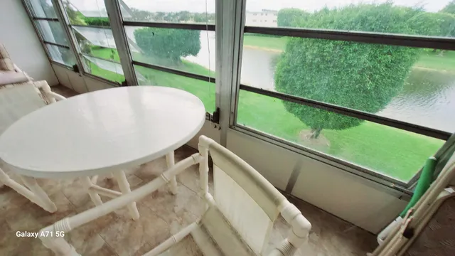 a view of a balcony with chairs