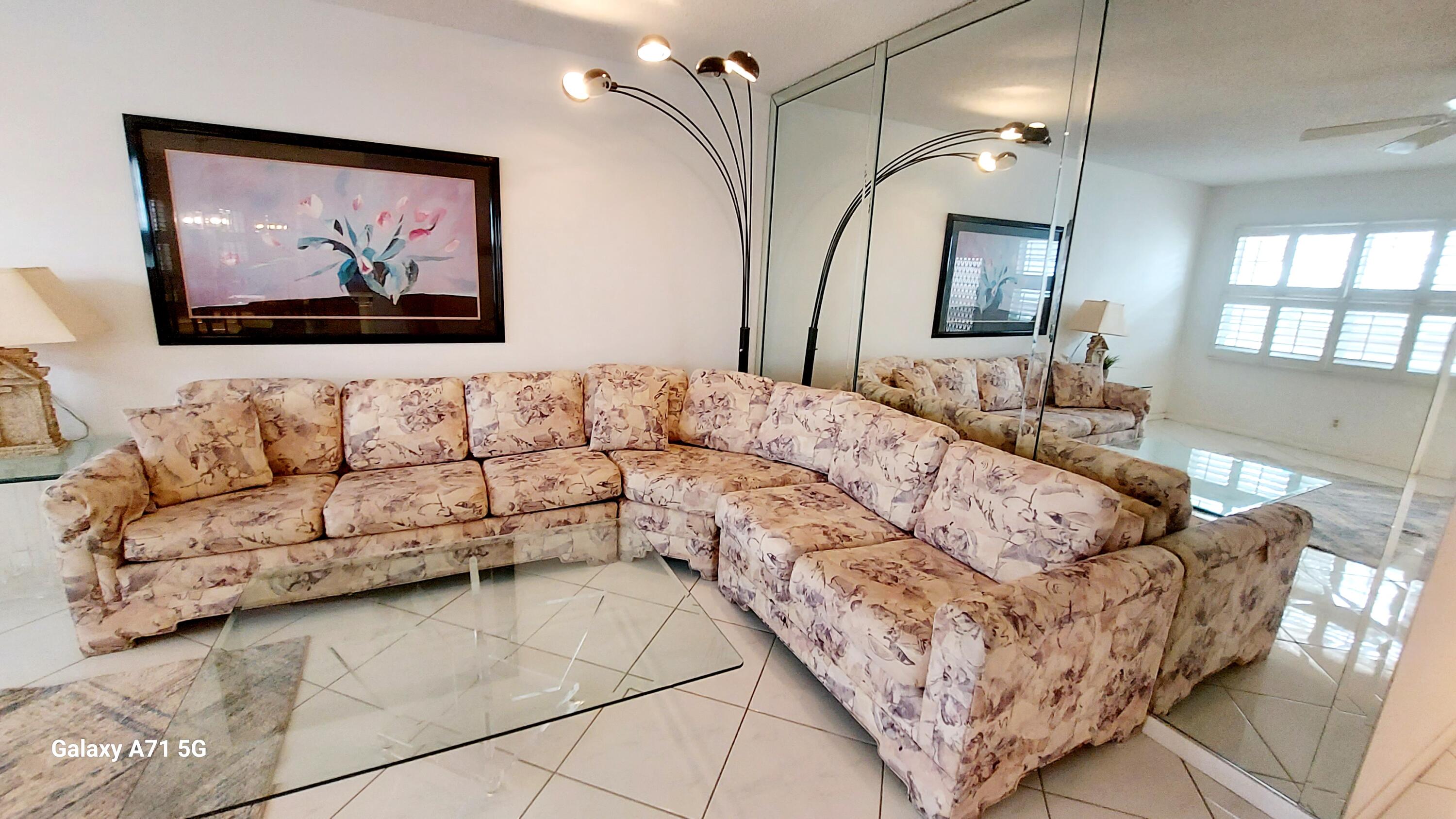 4079 Cornwall East, Unit 4079 Boca Raton, FL 33434 - Photo 3 of 41 a living room with a couch