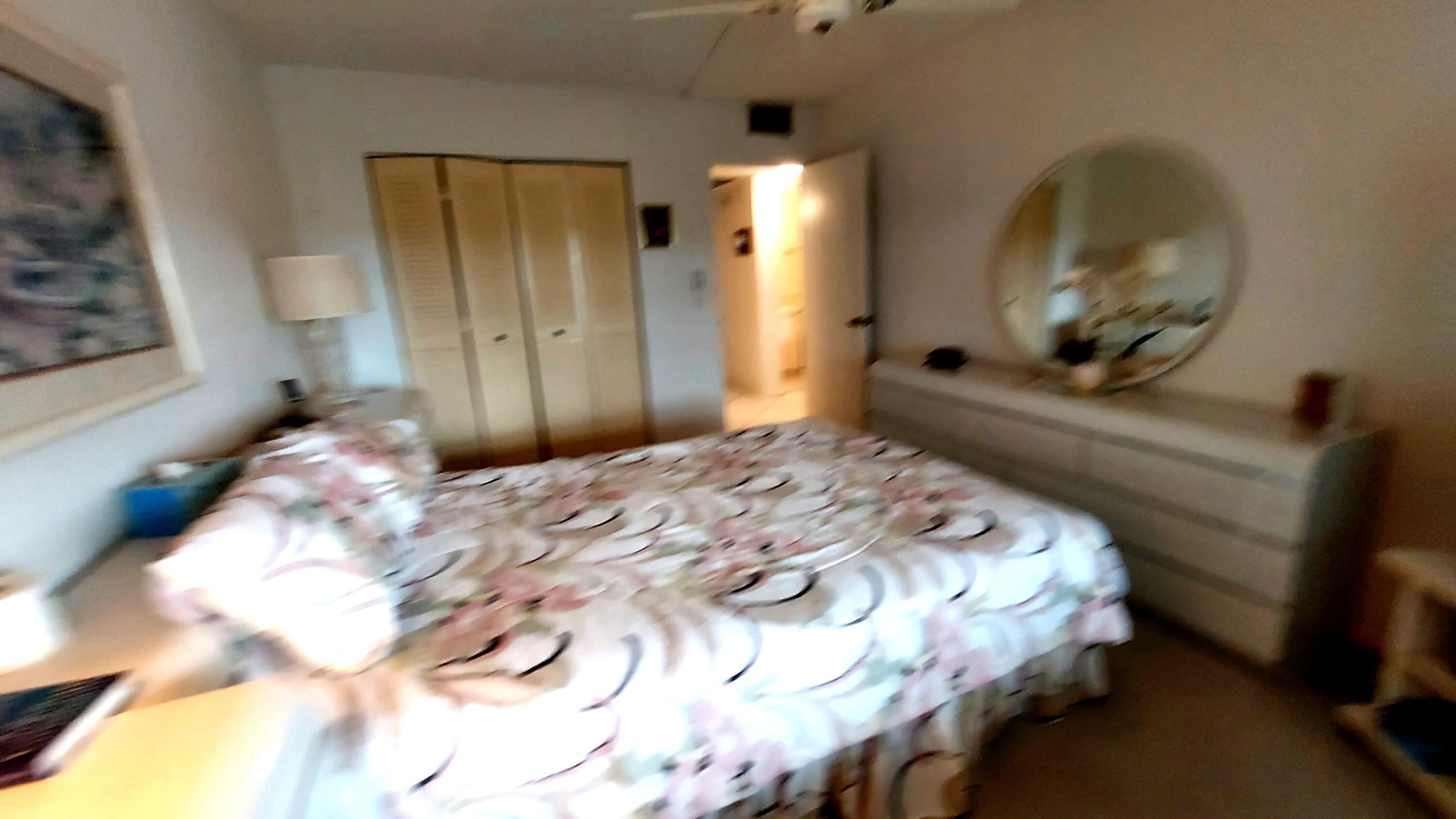 4079 Cornwall East, Unit 4079 Boca Raton, FL 33434 - Photo 10 of 41 a bedroom with a bed and a mirror