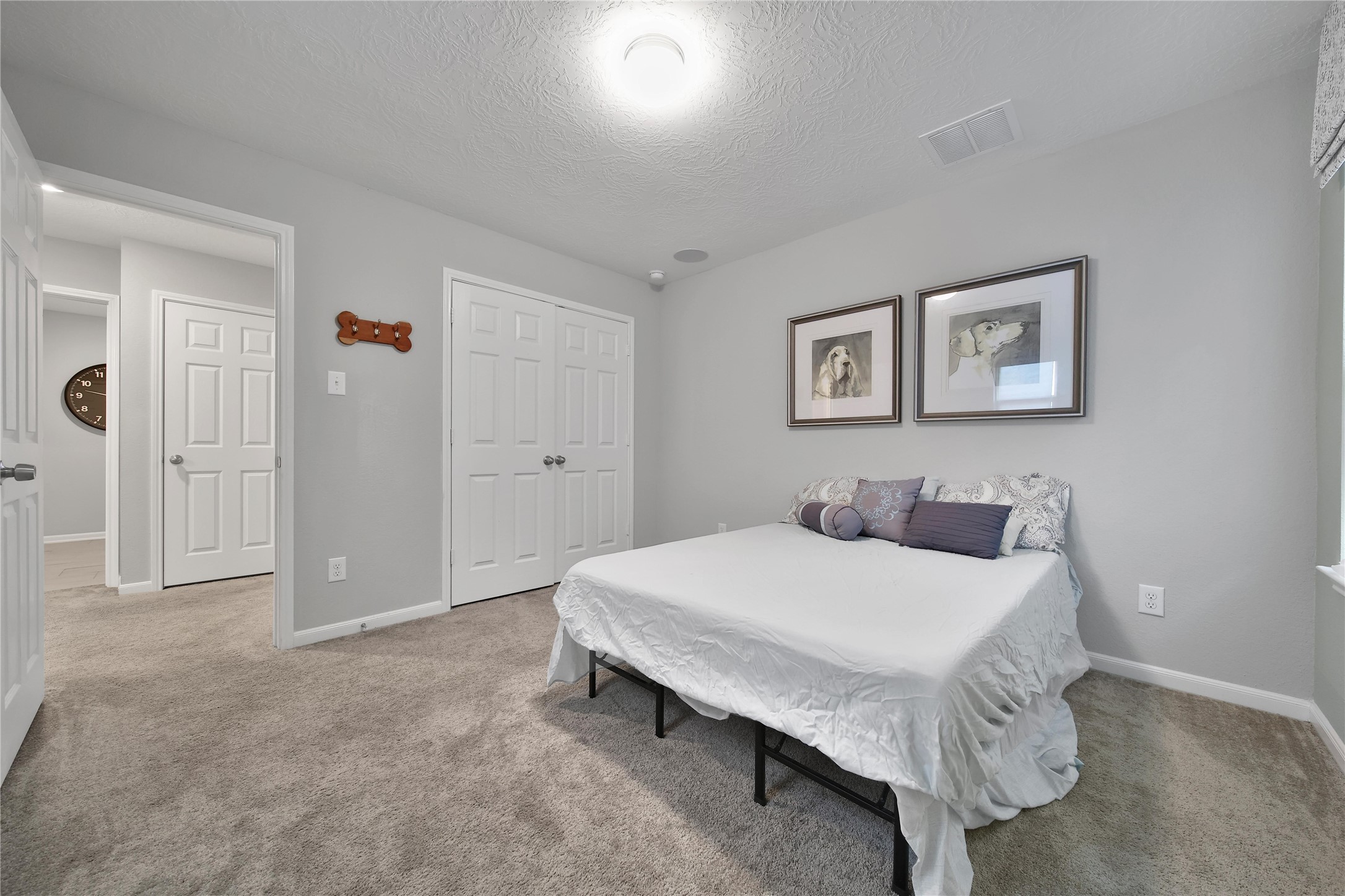 3306 Forest Chitto Dr Spring Spring, TX 77373 - Photo 29 of 35 a bedroom with a bed and a table