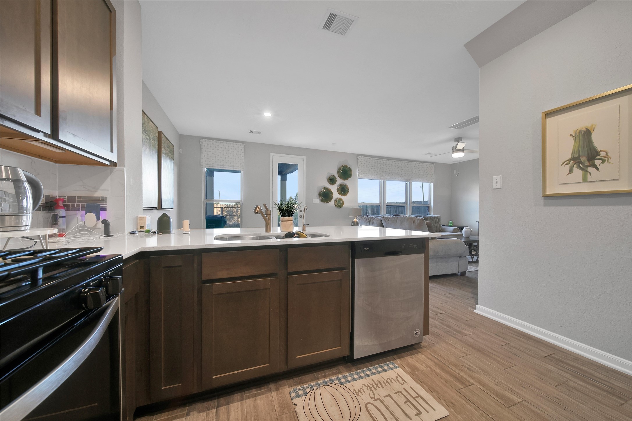 3306 Forest Chitto Dr Spring Spring, TX 77373 - Photo 10 of 35 a kitchen with stainless steel appliances granite countertop a sink stove and cabinets