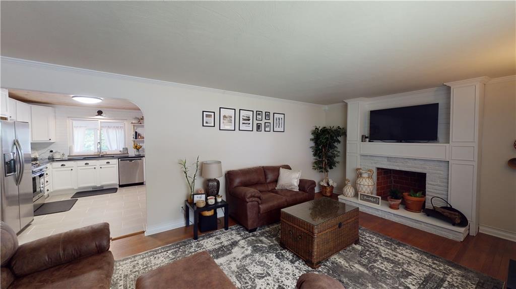 110 Weitzel Road Butler, PA 16002 - Photo 3 of 25 Living Room Featuring Decorative Fireplace and Hardwood Floors!