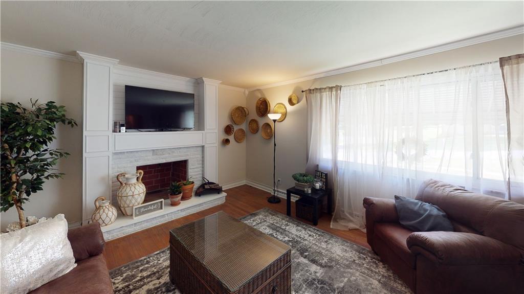 110 Weitzel Road Butler, PA 16002 - Photo 5 of 25 Living Room Featuring Decorative Fireplace and Hardwood Floors!