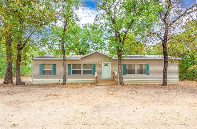 a house with trees in the background
