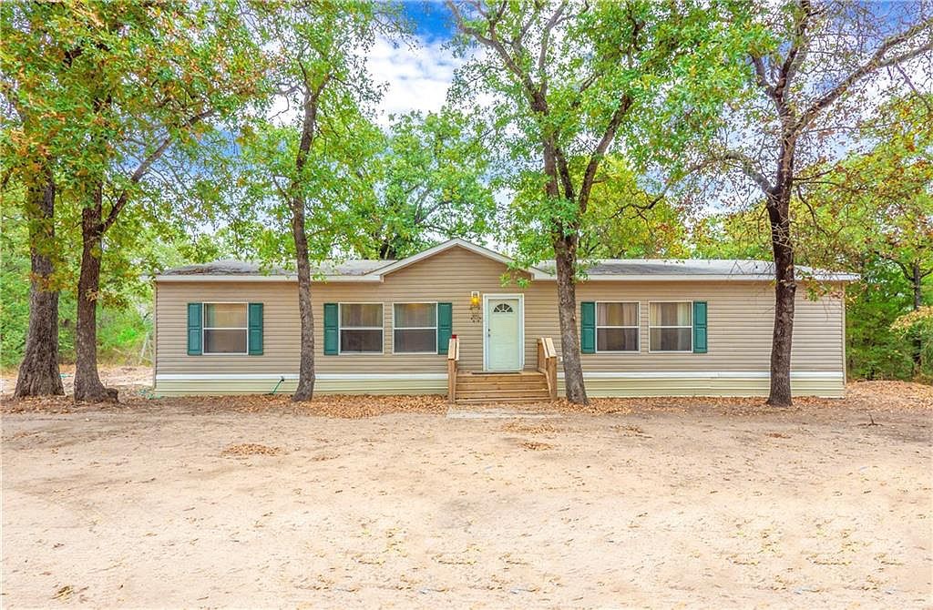 a house with trees in the background