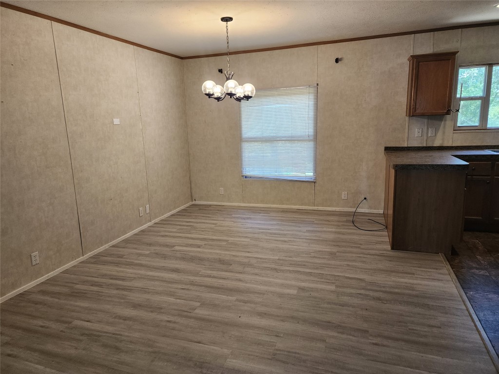 8315 Burleson Manor Road, Unit A Manor, TX 78653 - Photo 7 of 21 a view of empty room with wooden floor and fan