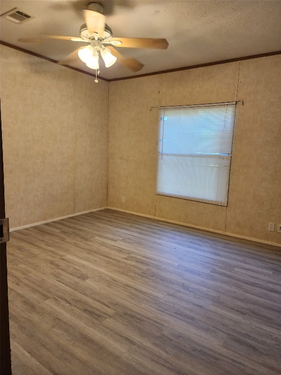 8315 Burleson Manor Road, Unit A Manor, TX 78653 - Photo 8 of 21 wooden floor in an empty room