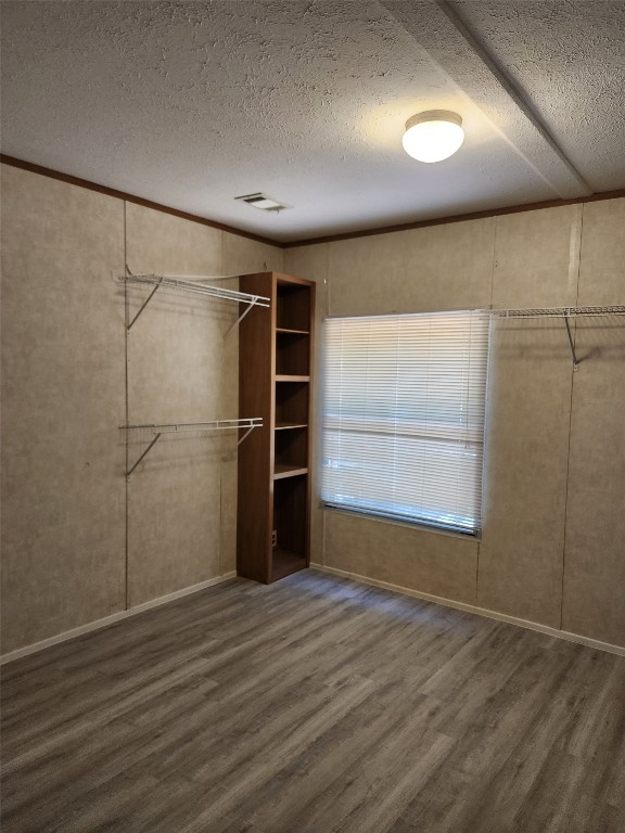 8315 Burleson Manor Road, Unit A Manor, TX 78653 - Photo 10 of 21 an empty room with wooden floor and windows