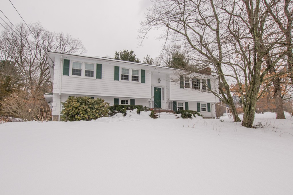 a view of a house with a snow in a yard