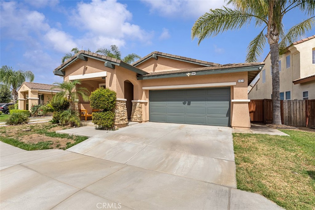 3871 Albillo Loop Perris, CA 92571 - Photo 1 of 1 a front view of a house with garden