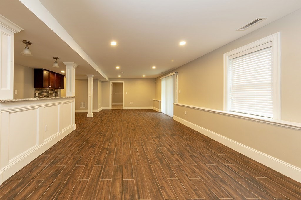 33 Liberty Avenue Lexington, MA 02420 - Photo 23 of 30 a view of a big room with wooden floor and a window