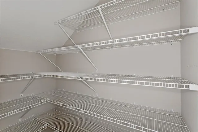 a view of a room with racks on the wall