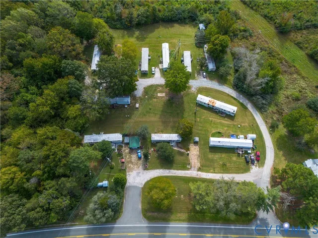 an aerial view of a house having swimming pool