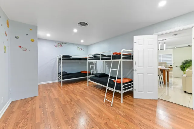 a living room with furniture a window and gym equipment