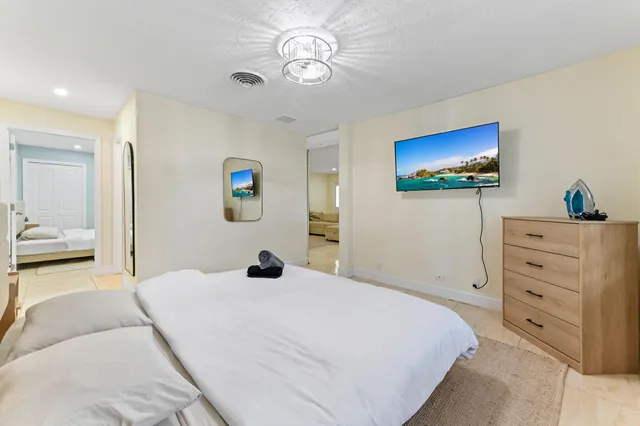a bathroom with a sink mirror vanity and toilet