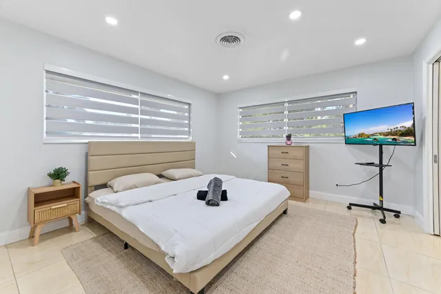 a bedroom with a bed and a cabinets