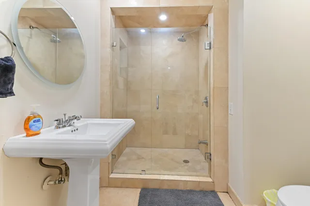 a bathroom with a sink and a shower