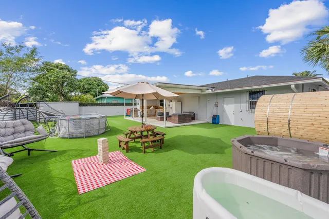 a view of a backyard with a patio