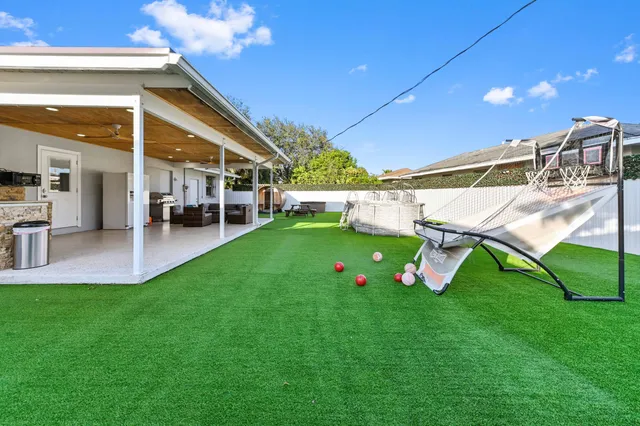 a house view with a sitting space and garden