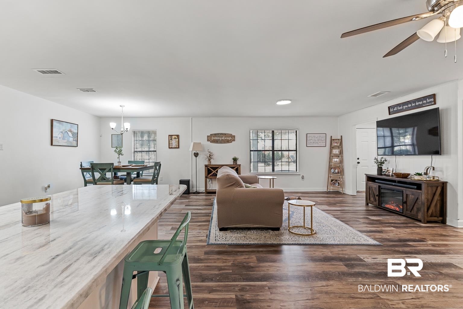 6801 Piney Woods Road Foley, AL 36535 - Photo 26 of 74 Living room with a chandelier, dark wood finished floors, and ceiling fan