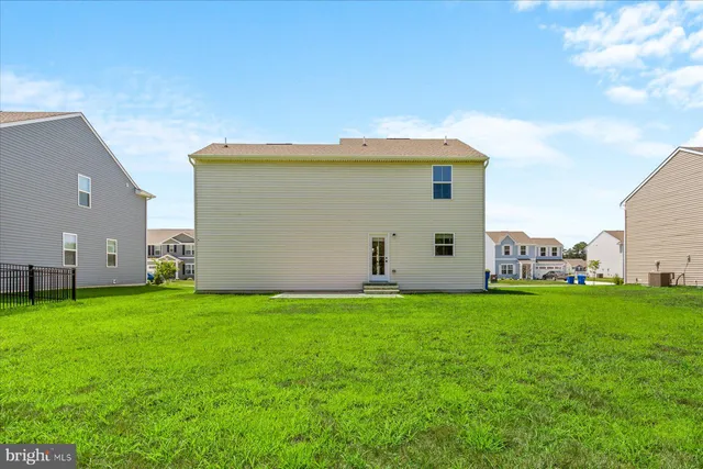 a view of a back yard of the house