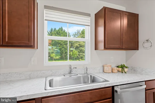 a kitchen that has a sink and a window