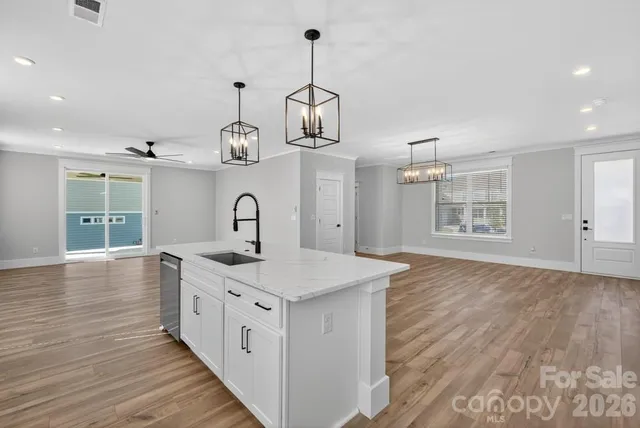 a kitchen with a sink and cabinets