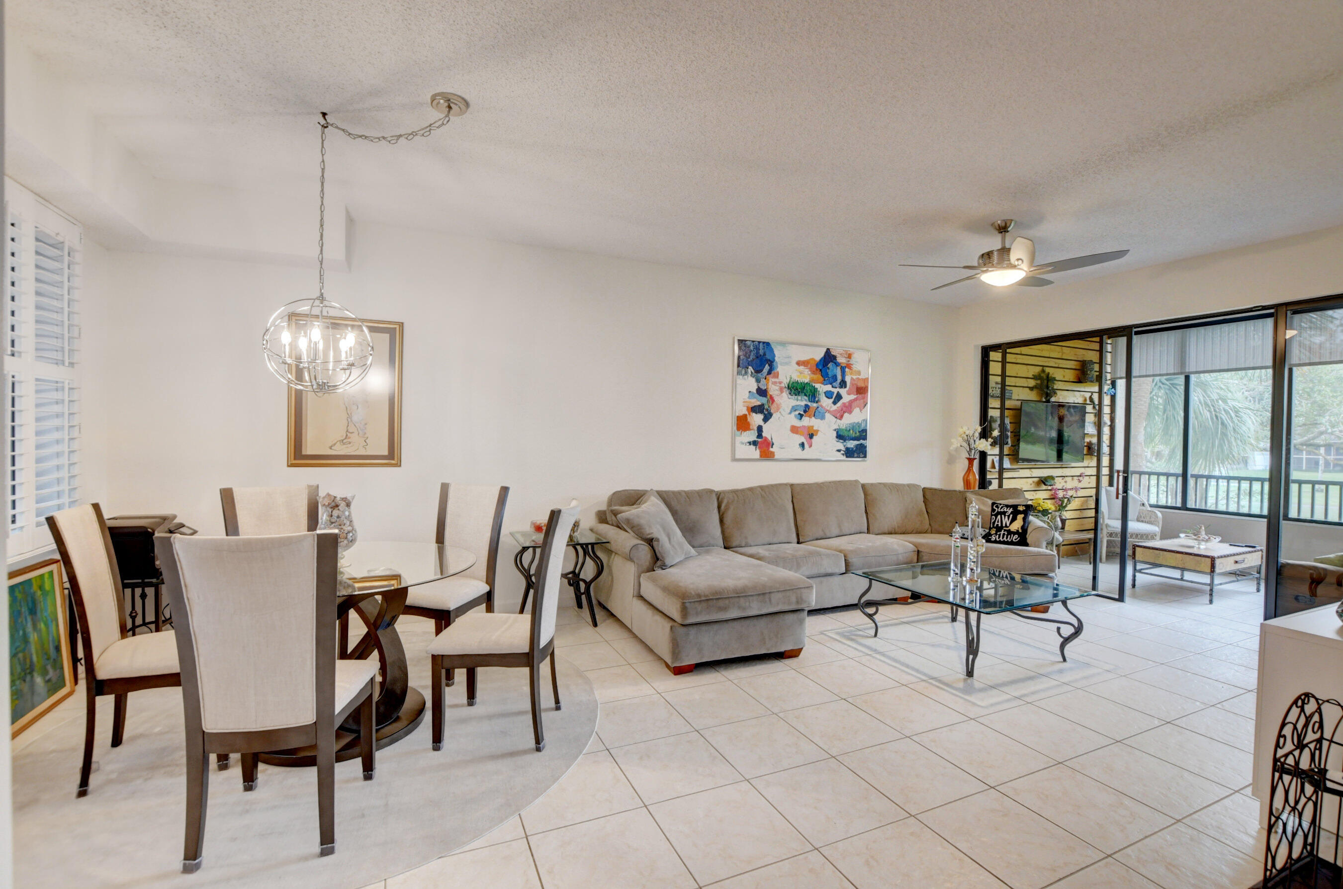 7546 La Paz Boulevard, Unit 207 Boca Raton, FL 33433 - Photo 6 of 25 dining and living room