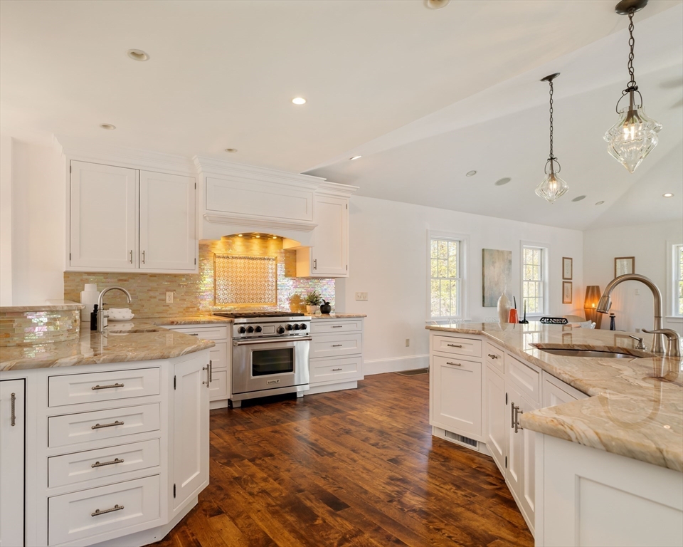 10 Rangeley Road Winchester, MA 01890 - Photo 12 of 42 a kitchen with granite countertop a sink stainless steel appliances and white cabinets