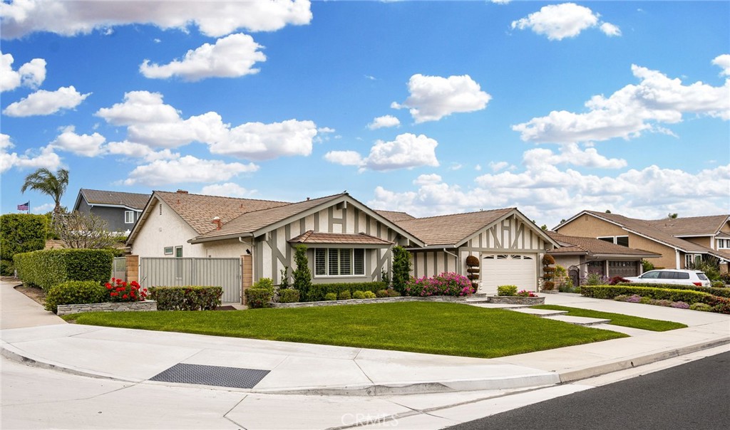 a front view of a house with a garden and pathway