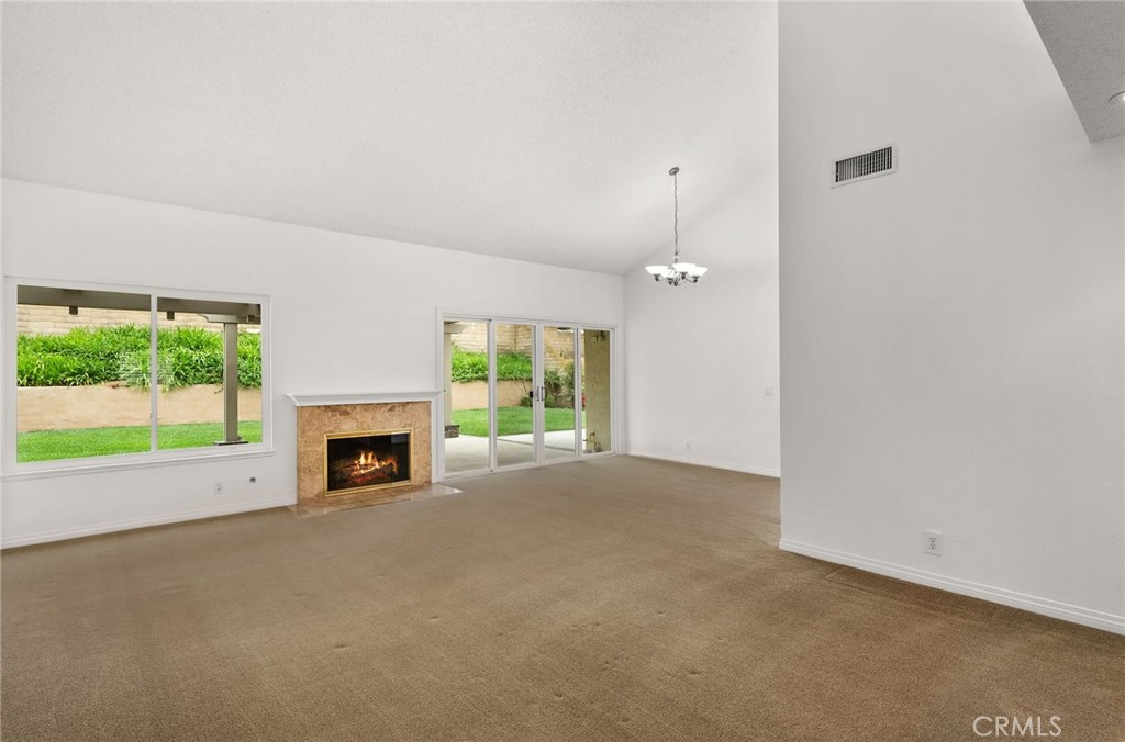 198 Sunflower Street Brea, CA 92821 - Photo 11 of 43 an empty room with windows and fireplace