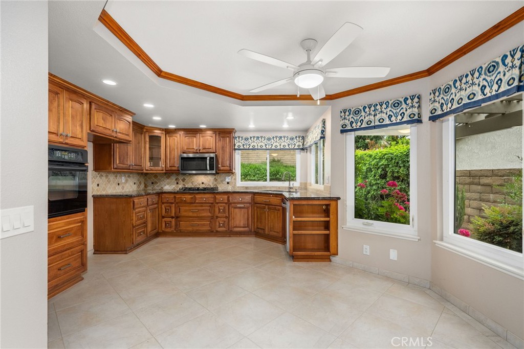 198 Sunflower Street Brea, CA 92821 - Photo 18 of 43 a kitchen with stainless steel appliances granite countertop a refrigerator and a stove top oven
