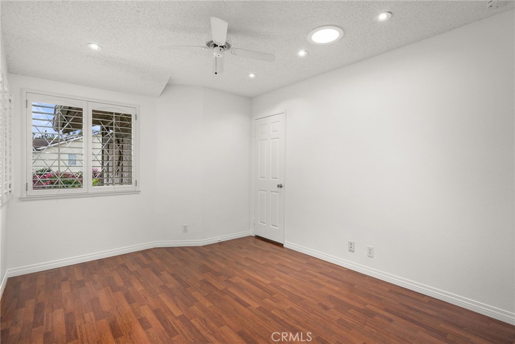 198 Sunflower Street Brea, CA 92821 - Photo 22 of 43 a view of empty room with wooden floor and fan
