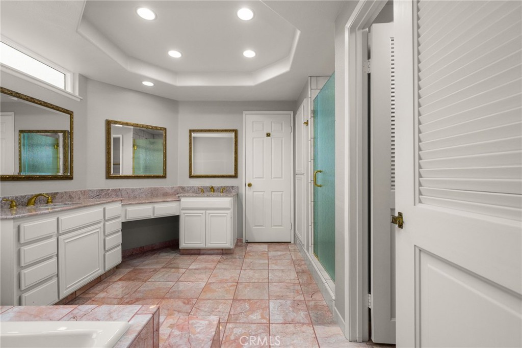 198 Sunflower Street Brea, CA 92821 - Photo 26 of 43 a large white bathroom with a granite countertop sink and a mirror